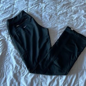 Nike black track pant with white stripe on side.